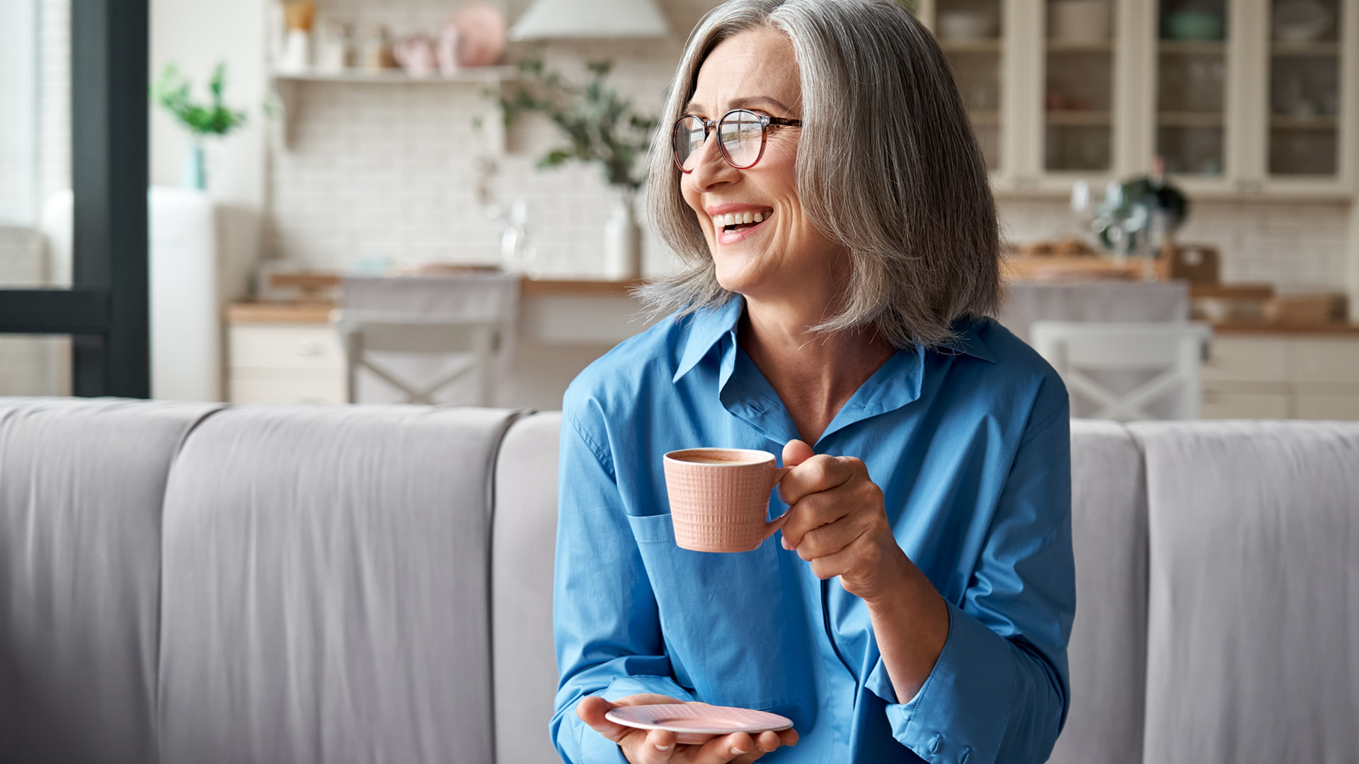 Older retired woman smiling.